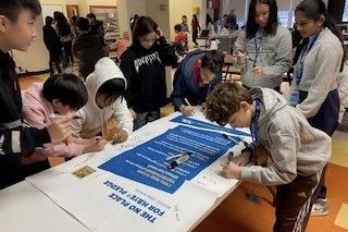 signing banner